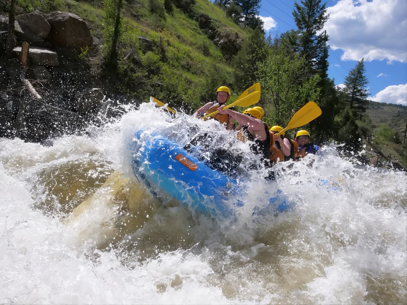 Guests cheering through a big Clear Creek rapid